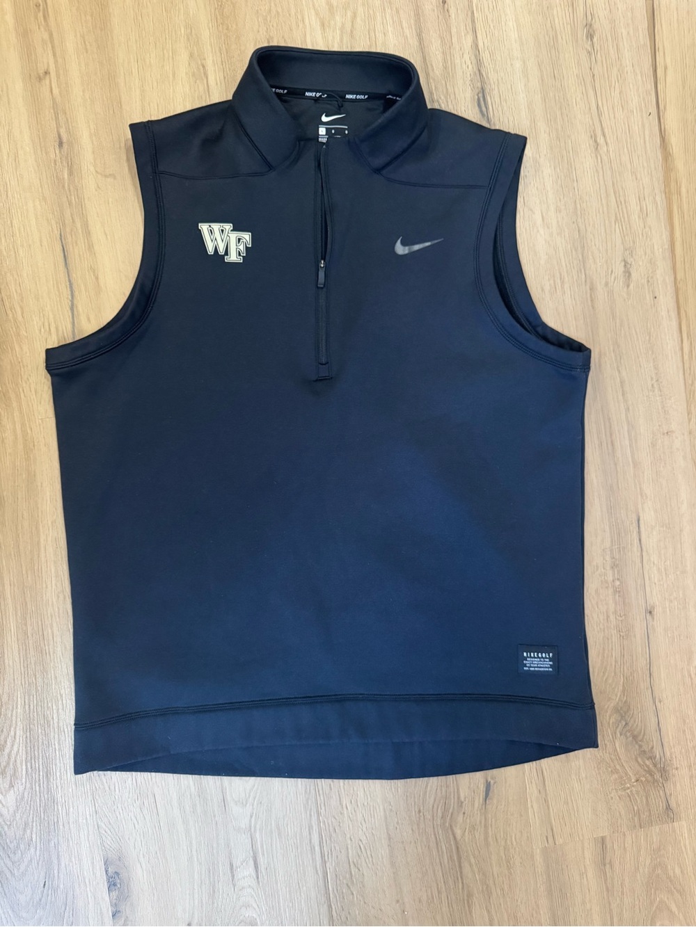 Nike Menβs Black Sleeveless Golf Vest with Wake Forest Logo